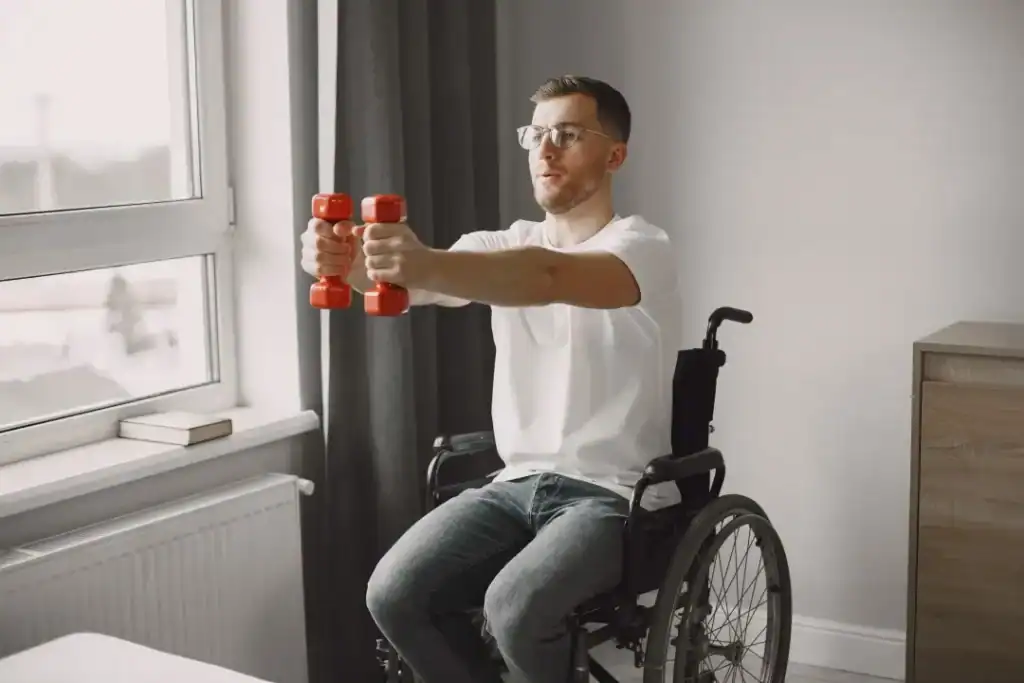 Image of man doing exercise in his wheelchair to aid weight loss Dorchester